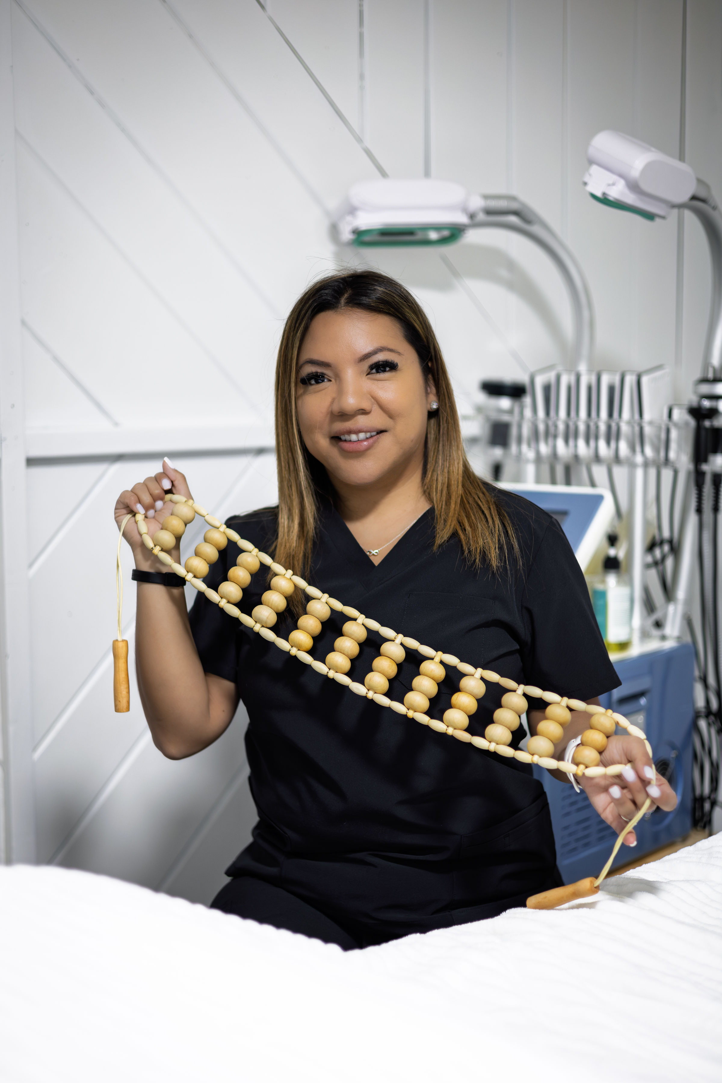 Jackie, founder of Bodi Bodega, with her body sculpting equipment